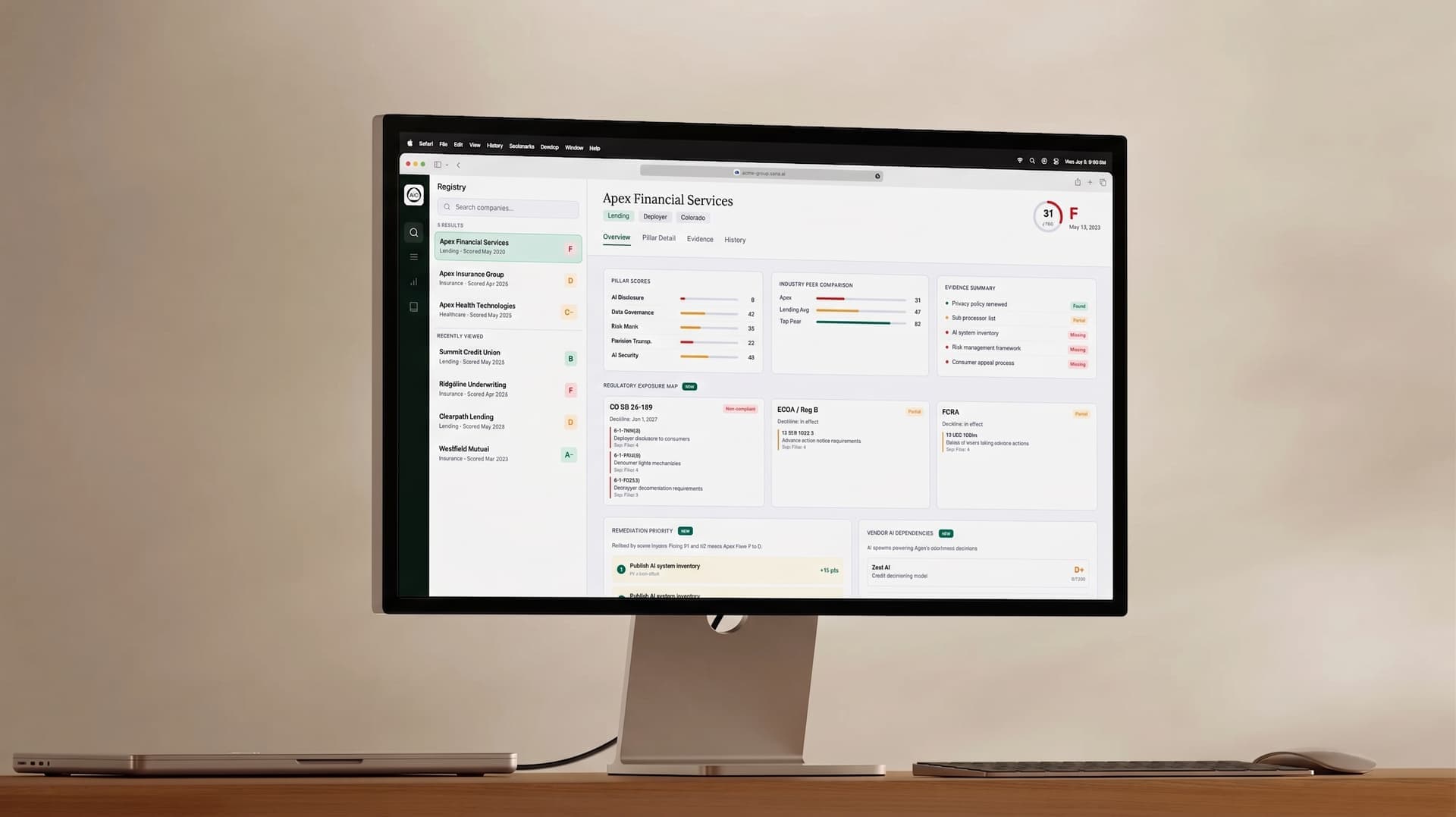 Mac monitor displaying the AI Clear registry dashboard with company transparency scores and pillar breakdowns